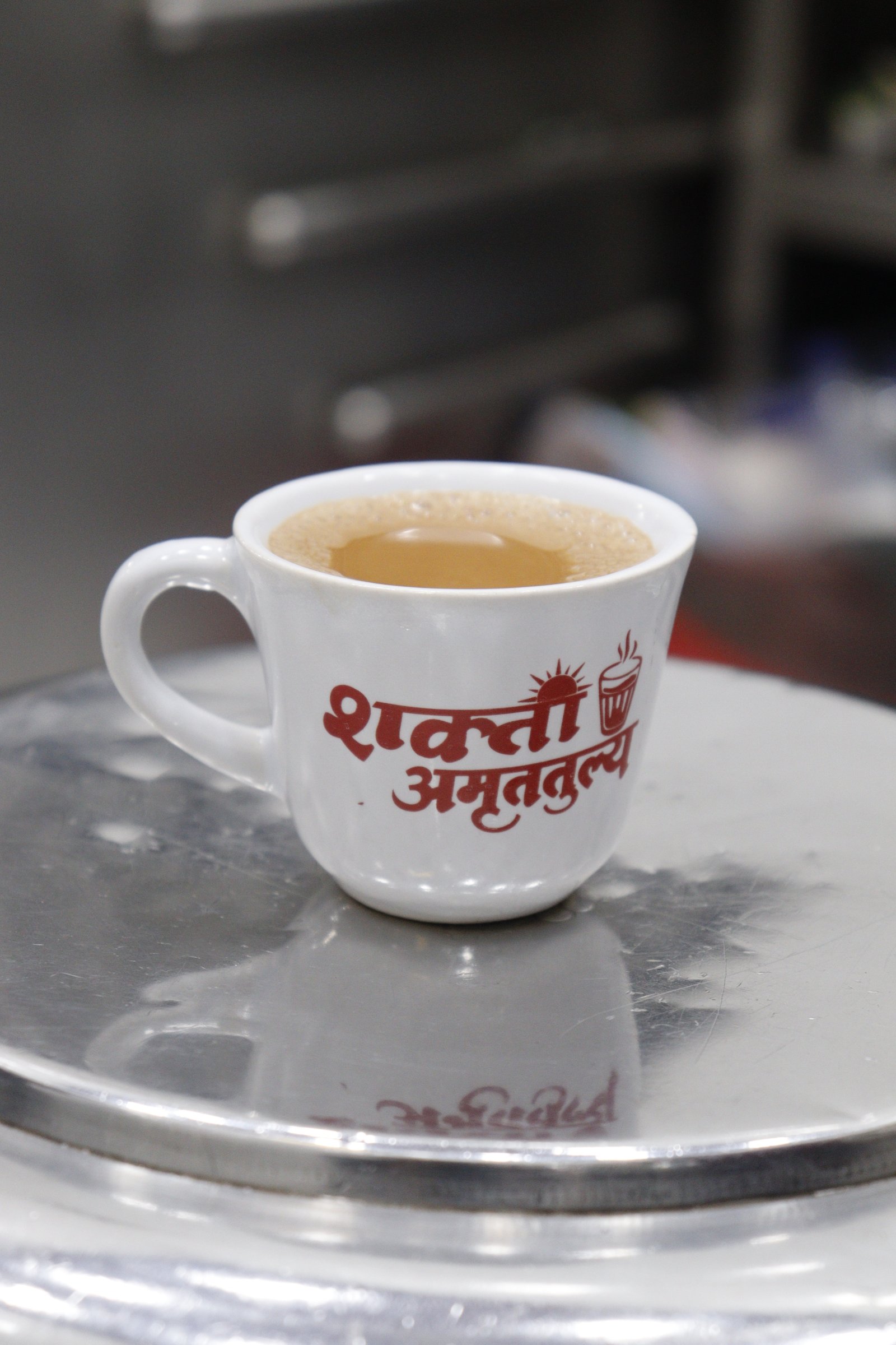 Fresh tea in a Shakti Amrutatulya branded cup